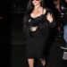 Rihanna exiting a vehicle, wearing a black outfit.