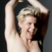 Image may contain Robyn Blonde Hair Person Head Face Happy Smile Photography and Portrait