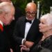 Charles speaks to Stanley Tucci and Dame Judi Dench in the Grand Reception Room after they attended the premiere on Wednesday