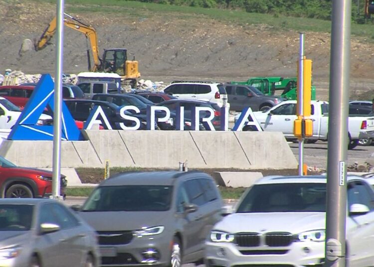 Cars drive by the Aspiria Campus located in Overland Park, Kansas. (Spectrum News)