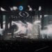 a DJ on stage at an edm concert