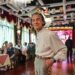 An elderly man poses for a picture at the Hai Shang Jiu Meng Dance Hall in Shanghai. For the elderly, dance halls are gyms, entertainment venues and social clubs rolled into one. Photo: AFP