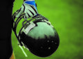 Player holding football helmet