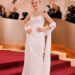 Amanda Seyfried in a dazzling white gown cut on the bias.