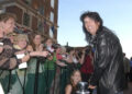 During the BMW Charity Pro Am red carpet walk in downtown Greenville Thursday night, Alice Cooper basks in fans' attention as he walks the red carpet.