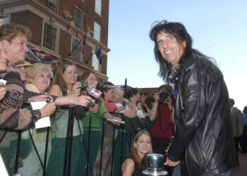During the BMW Charity Pro Am red carpet walk in downtown Greenville Thursday night, Alice Cooper basks in fans' attention as he walks the red carpet.