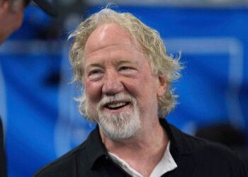 Actor Timothy Busfield smiles before an NFL football game in Detroit, Sept. 14, 2025. (AP Photo/Paul Sancya, File)