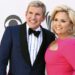 Todd and Julie Chrisley pose on a red carpet in 2017.