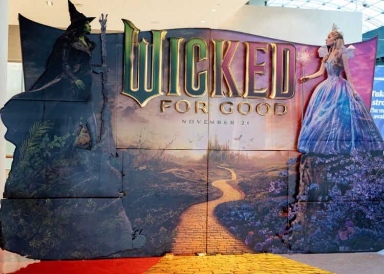Photo shows a cardboard cut-out advertising the latest 'Wicked' movie, starring Cynthia Erivo and Ariana Grande