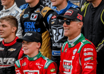 Former NASCAR Cup Series champion Kevin Harvick, center, right, and his son Keelan, 13, look on before the two raced in the 13th annual Masters of the Pros 200 race on Wednesday, July 16, 2025, at the Owosso Speedway.