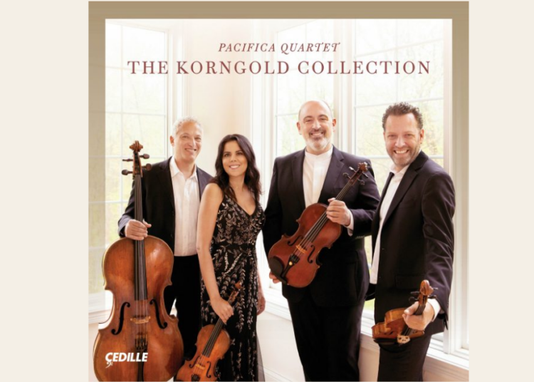 Four musicians from the Pacifica Quartet stand indoors holding string instruments in front of a window; the album is titled The Korngold Collection.
