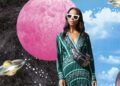 Woman standing in front of a planetary landscape