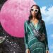 Woman standing in front of a planetary landscape