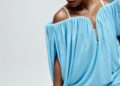 Keke Palmer wearing a short blue dress and staring at the camera
