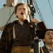 Jack and Fabrizio standing at the front of the Titanic in Titanic (1997)