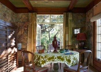 Image may contain Dining Table Furniture Table Architecture Building Dining Room Indoors Room and Lamp