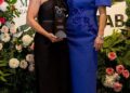 Nodding to her regal heritage at Magic Millions, Zara wore this royal blue midi dress with puff sleeves and flattering embellishment across the bodice