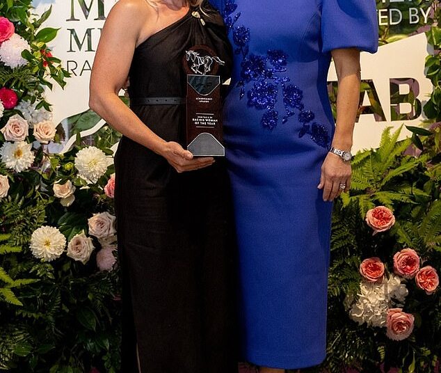 Nodding to her regal heritage at Magic Millions, Zara wore this royal blue midi dress with puff sleeves and flattering embellishment across the bodice