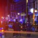 Police and an ambulance at the scene of a shooting in Richmond's Shockoe Bottom neighborhood.
