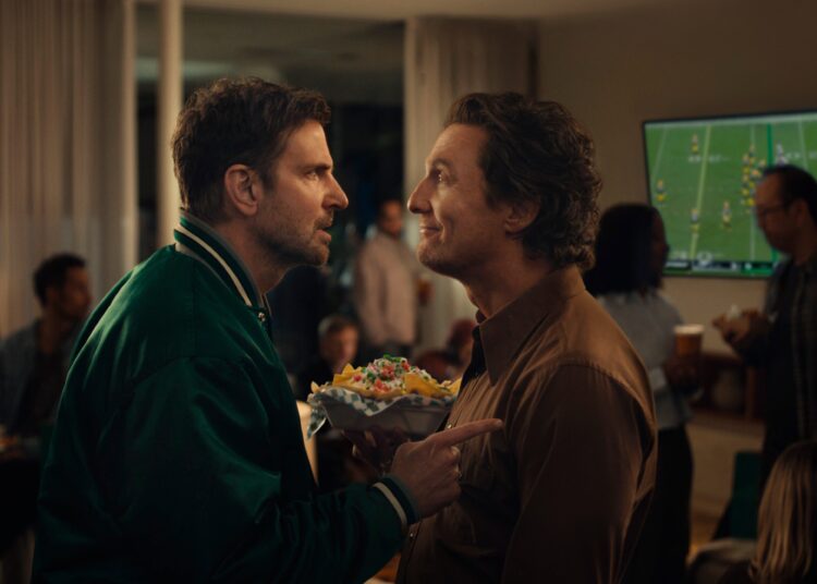 This undated image provided by Uber Eats shows Bradley Cooper, left, and Matthew McConaughey in a scene from the Uber Eats 2026 Super Bowl NFL football spot.