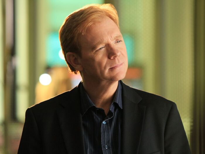 Actor looking thoughtful in a dark blazer, representing actors who thought they were too good for their franchises.