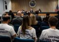 Federal Communications Commission commissioners Anna Gomez, Brendan Carr and Olivia Trusty during a meeting at the FCC headquarters in Washington, DC, on September 30, 2025.