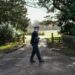 A policeman stands guard at an entrance to Wood Farm on the royal family's Sandringham Estate in Norfolk, eastern England on February 22, 2026, after Britain's former prince Andrew was arrested on February 19. - IslanderNews.com