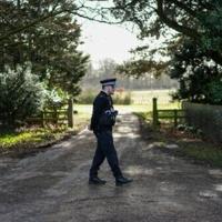 A policeman stands guard at an entrance to Wood Farm on the royal family's Sandringham Estate in Norfolk, eastern England on February 22, 2026, after Britain's former prince Andrew was arrested on February 19. - IslanderNews.com
