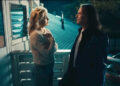 Kate Hudson and Hugh Jackman look at each other in Song Sung Blue.