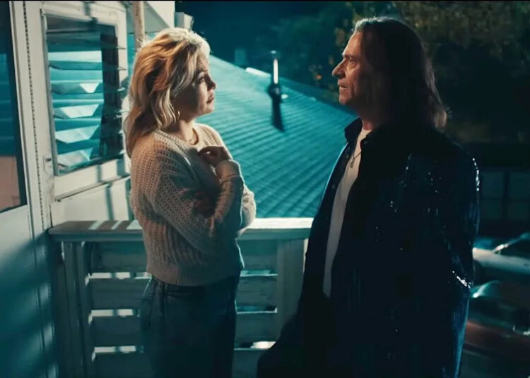 Kate Hudson and Hugh Jackman look at each other in Song Sung Blue.