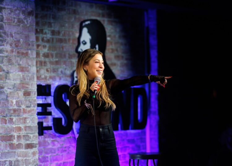 Greenberg on stage at The Stand comedy club in New York City.