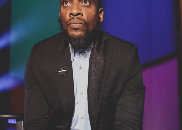 Ali Siddiq sometimes sits to deliver stand-up.