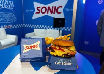 fast food items on a table with a blue background