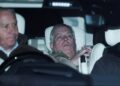 Andrew Mountbatten-Windsor lies down with wide eyes in a car, a man in front of him.