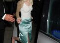 Anya Taylor-Joy elevated a plain white tank top with a satin skirt, a fur-trimmed bolero, and square-toe kitten heels