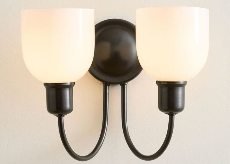 Bronze double wall sconce with frosted glass shades