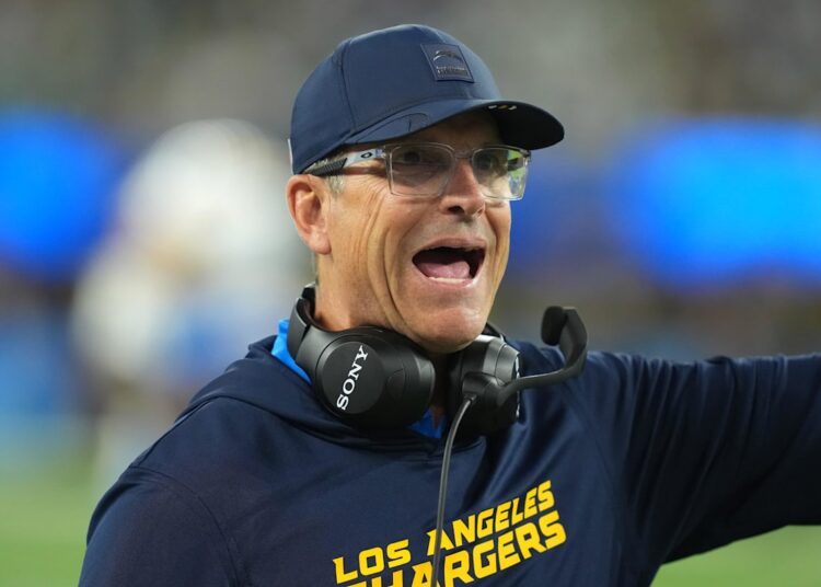 Dec 8, 2025; Inglewood, California, USA;  Los Angeles Chargers head coach Jim Harbaugh reacts in the first half against the Philadelphia Eagles at SoFi Stadium. Mandatory Credit: Kirby Lee-Imagn Images
