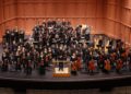 Members of an orchestra on a stage. Furman Symphony Orchestra.