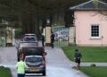 A convoy with police officers travels into the Royal Lodge on Saturday. Pic: Reuters