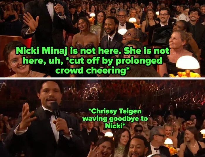 Person in tuxedo speaking to audience at an award event. The crowd is smiling and engaged, seated around small lit tables