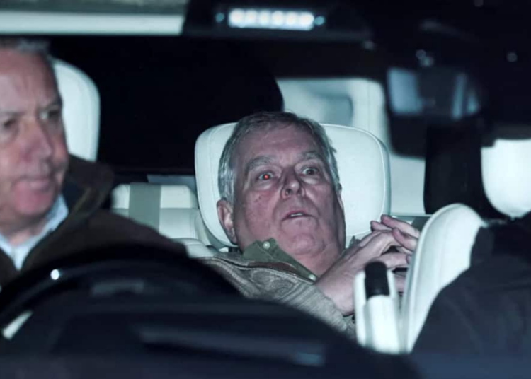 Andrew Mountbatten-Windsor with a shocked expression in the backseat of a car.