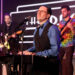 Producer and band leader Kenny Davidsen sings during a birthday party benefit for Las Vegas Rev ...