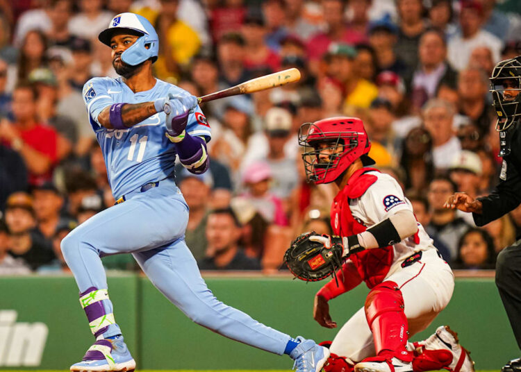 Aug 5, 2025; Boston, Massachusetts, USA; Kansas City Royals third base Maikel Garcia (11) hits a double to drive in a run against the Boston Red Sox in the fourth inning at Fenway Park. Mandatory Credit: David Butler II-Imagn Images