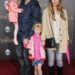 Eric Dane carries one young daughter and holds the other daughter's hand along with wife Rebecca Gayheart