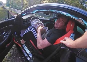 Newly released police video shows former WWE executive Vince McMahon ram his luxury sportscar into the rear end of another vehicle as he was being followed by a state trooper last summer in Connecticut.