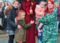 Catherine, Princess of Wales, takes a moment to greet young well-wishers during her visit to Wales.