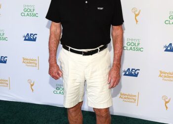 Jonathan, now 79, had a full head of hair before it started to recede and eventually go bald at a young age (pictured in 2025)