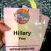 The author holding a pink cruise lanyard, which has her name and the words "Postgame Access Pass."