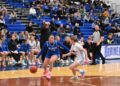 Girls playing basketball.