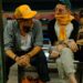 Damon Albarn, left, and Jamie Hewlett, right, of Gorillaz, sit on a bench in Varanasi, India.
